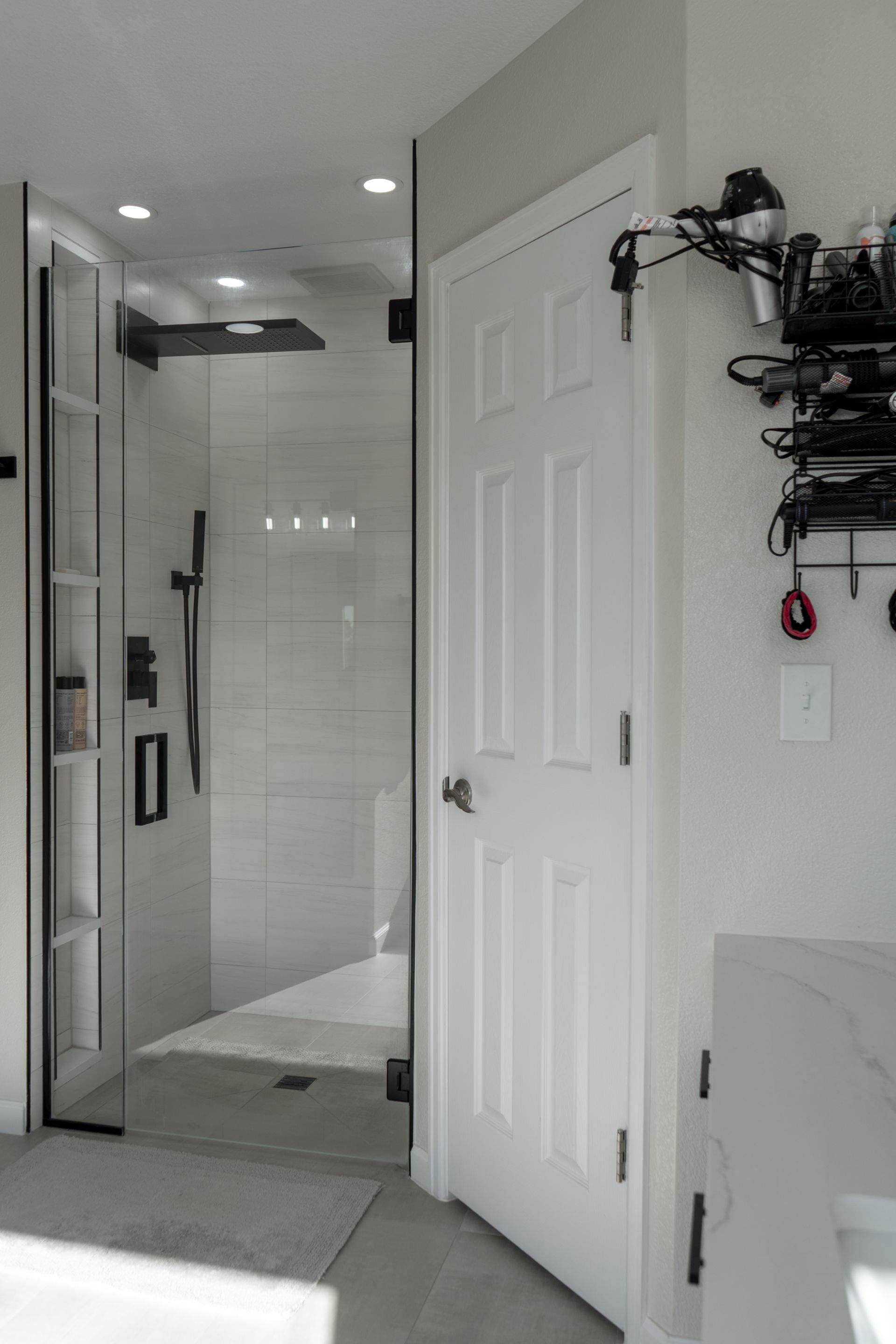 Modern bathroom with a glass shower, sleek fixtures, and neutral decor.