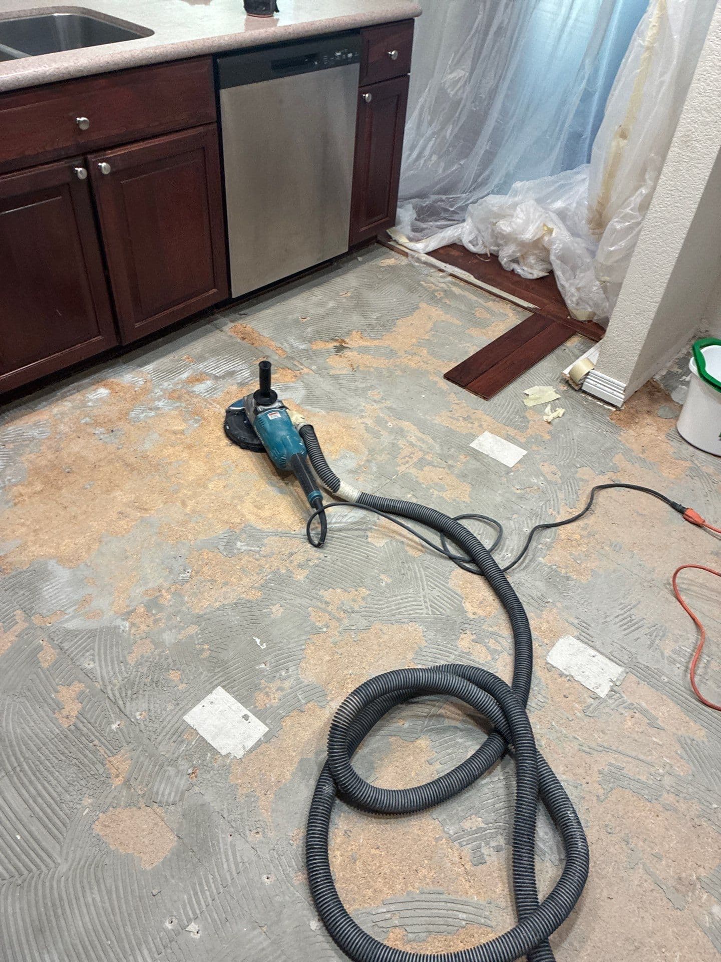 Gallery photos for Kitchen Floor Swap - Old Tile Out, Hardwood Look In: Image #1
