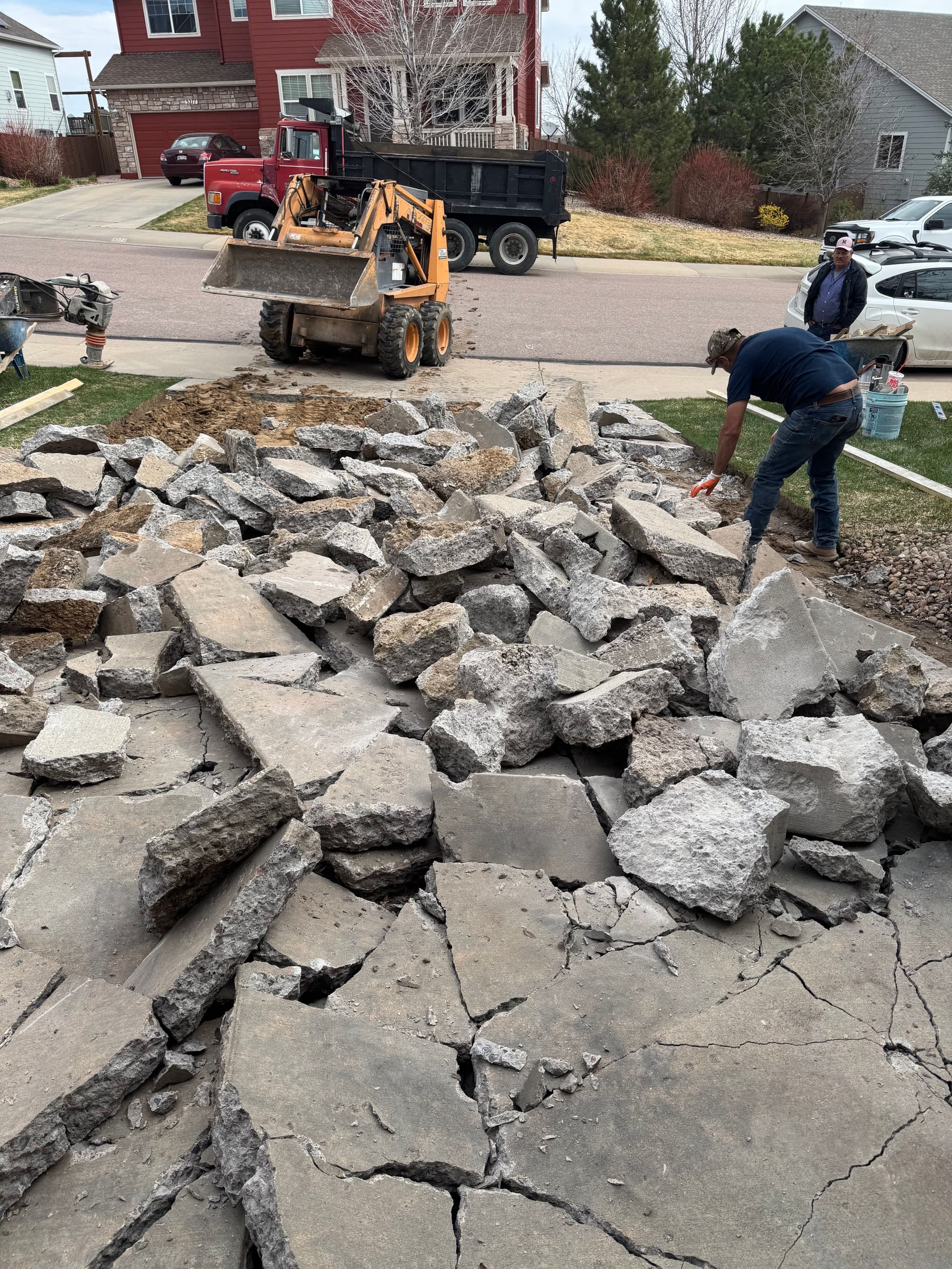 Cracked Driveway Demolished and Replaced With Fresh Concrete image